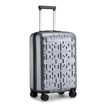 Silver hard-shell suitcase with a raised geometric pattern, featuring a telescopic handle and 360° spinner wheels for optimal manoeuvrability.